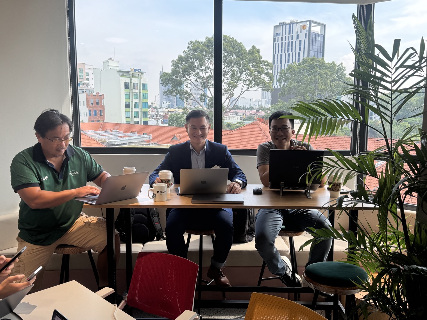 A company team building at one table with an engineer